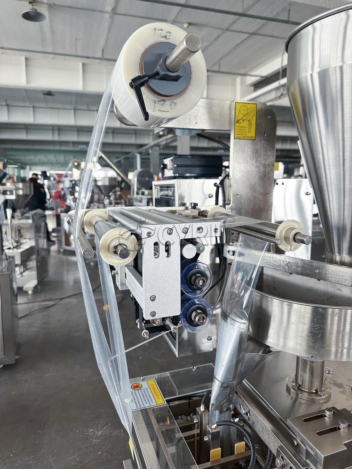 Four-edge sealing granule packaging machine
