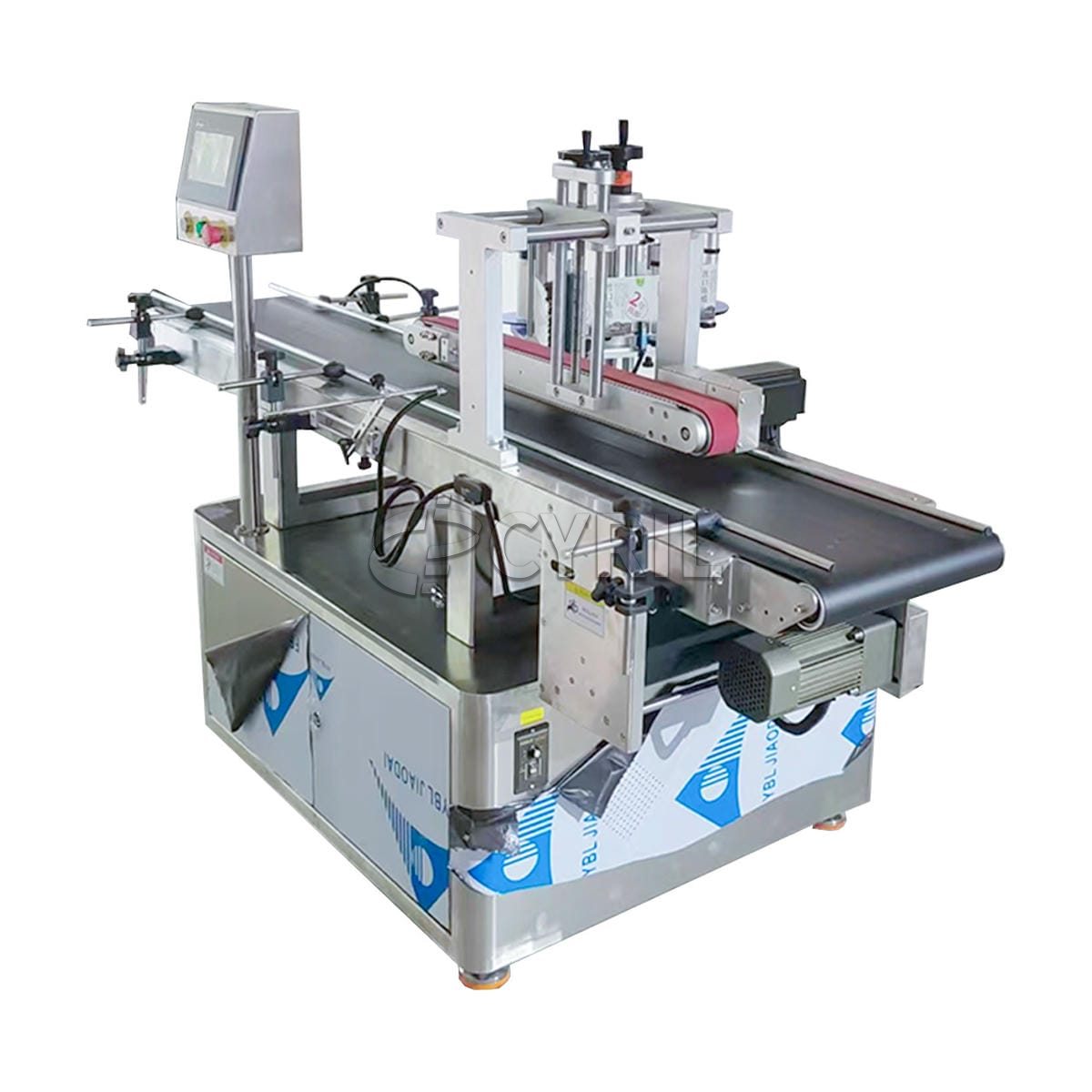 Top side labeling machine