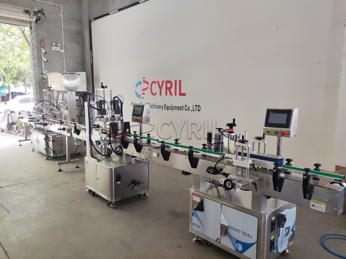 4-Head Gear Pump Filling Machine + 4-Wheel Capping Machine + Round Bottle Wrap-Around Labeling Machine