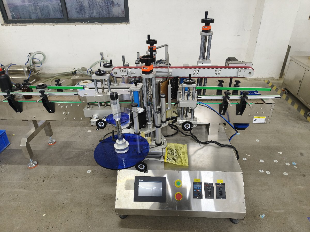 Desktop dual-head lobe pump filling machine + four-wheel alignment + double-sided labeling machine