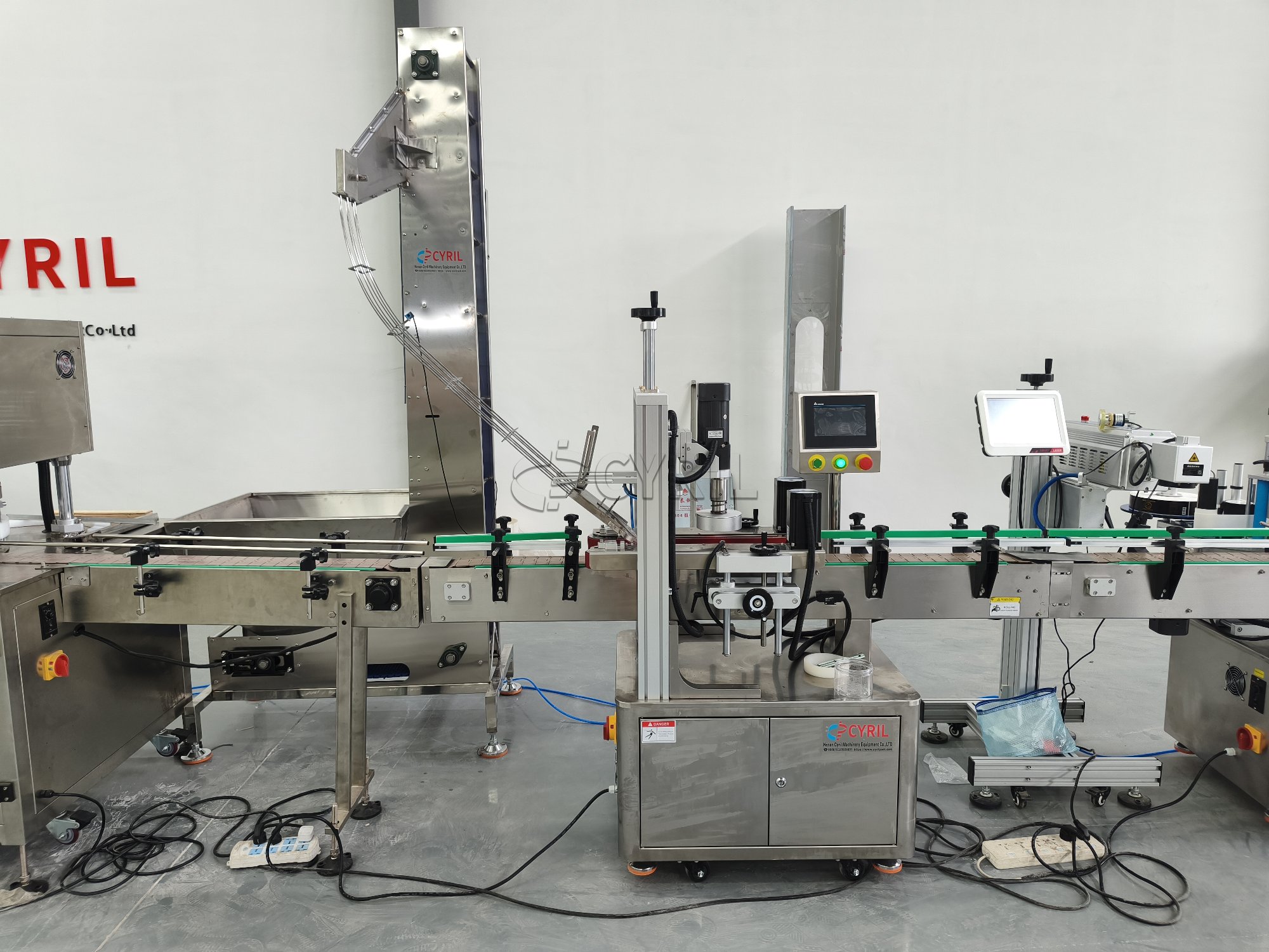 Four-head weighing filling machine + aluminum cap capping machine + single-head capping machine + laser coding machine + round bottle positioning system