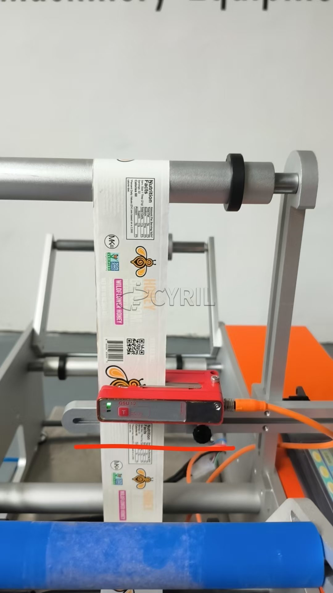 Semi-automatic round bottle labeling machine + Orange