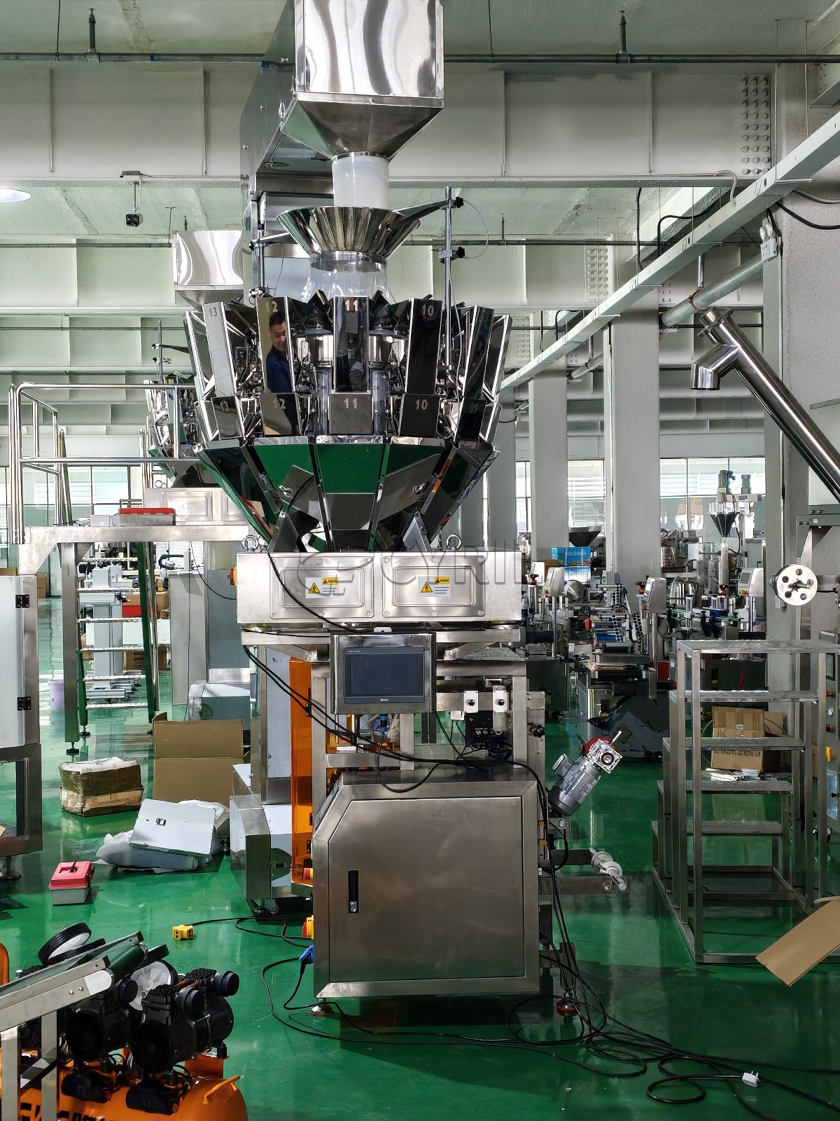 Combination weigher paired with a 340 collar-type packaging machine.