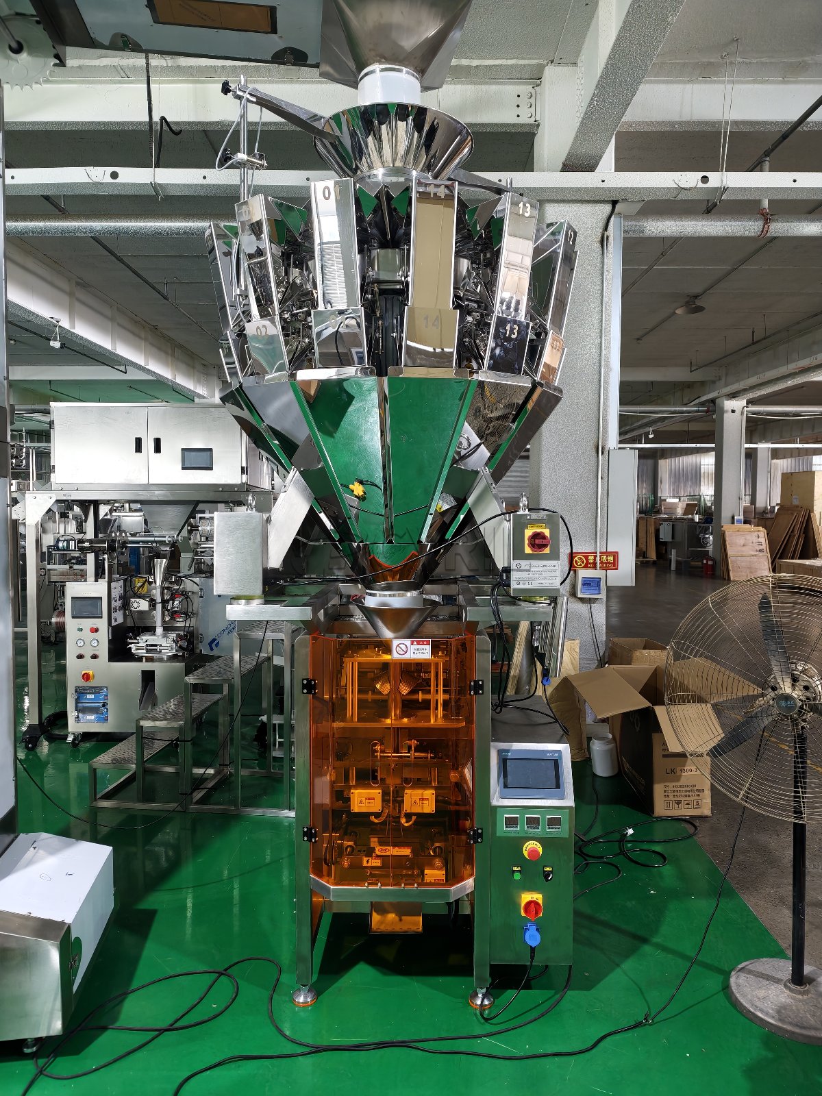 Combination weigher paired with a 340 collar-type packaging machine.